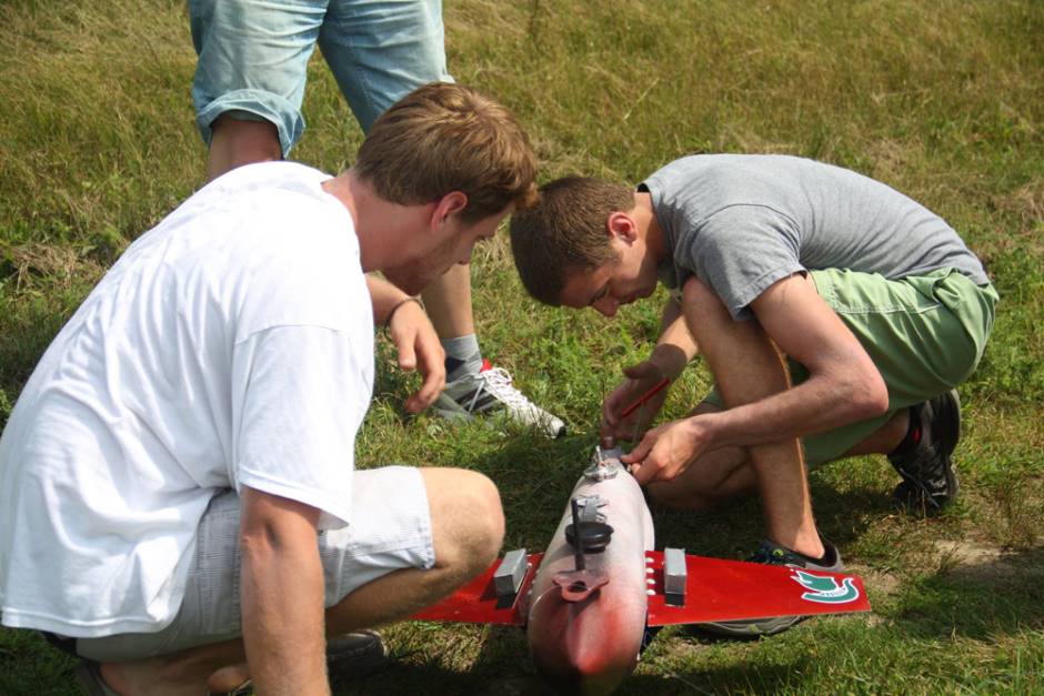 Students at work on the robotic fish before testing in Wintergreen Lake